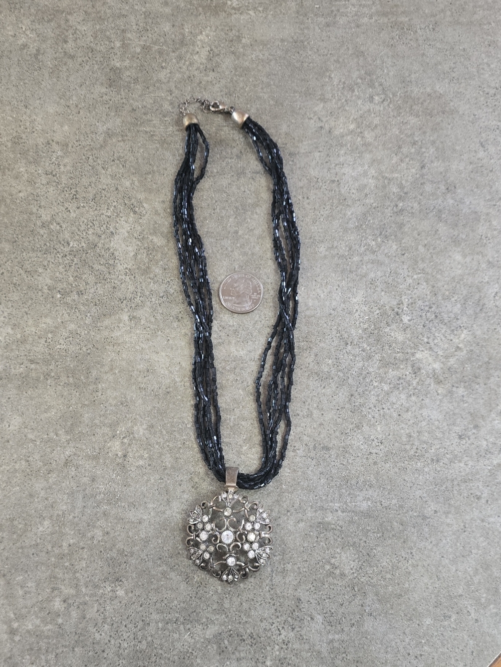 Silver Floral Pendant Necklace with Black Multi-Strand Beads
